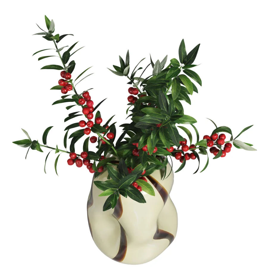 Decorative floral arrangement with red berries and green foliage in a sculptural vase (Skimmia) Image 5