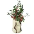 Decorative floral arrangement with red berries and green foliage in a sculptural vase (Skimmia) - Thumbnail 1